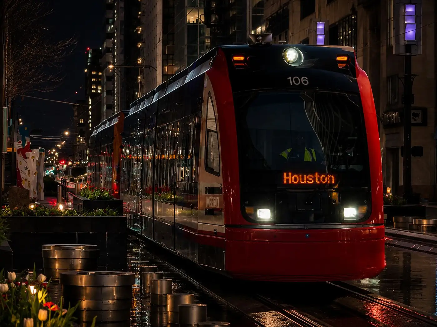 The METRORail on Main Street at night, outside Velvet Rail