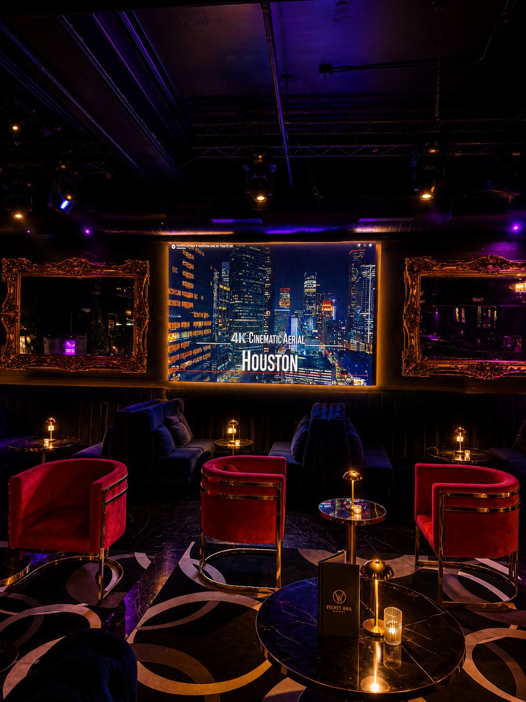 Red velvet chairs and gold mirrors at Velvet Rail