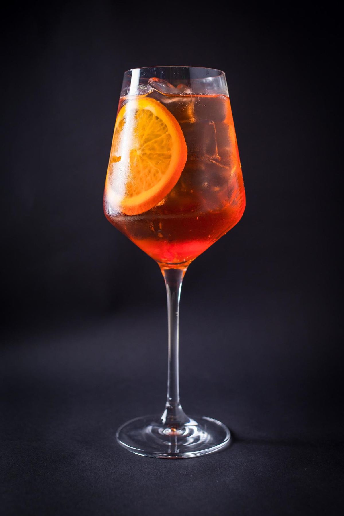 A spritz with orange on black