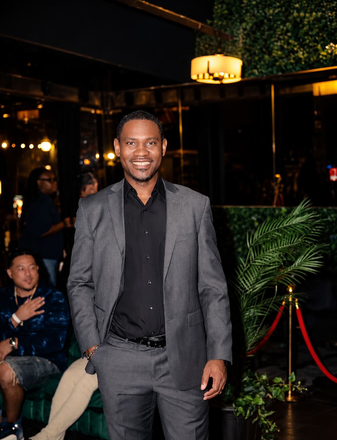 A guest arriving past the velvet rope